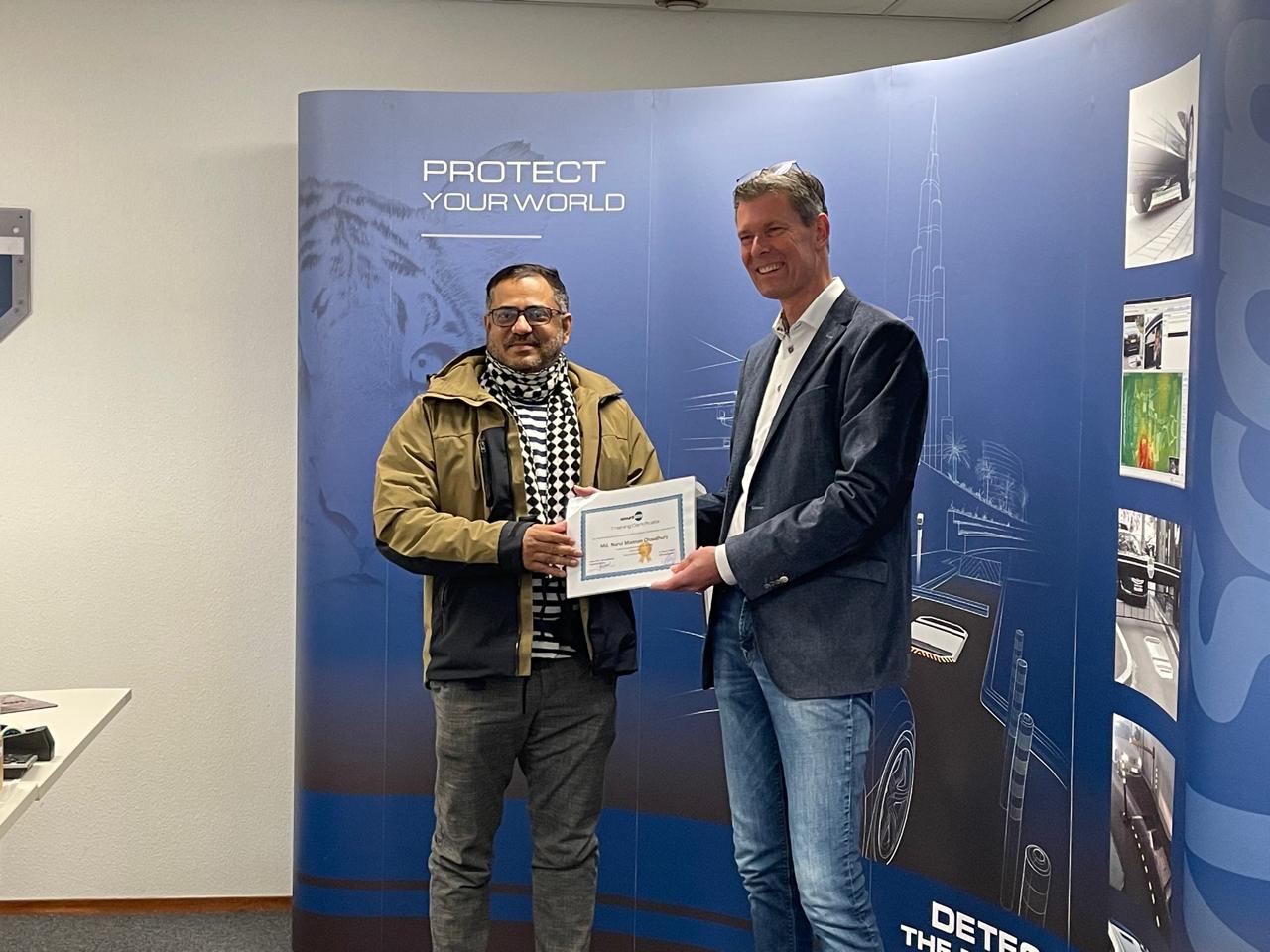 Managing Director receiving a professional certificate at an international security event