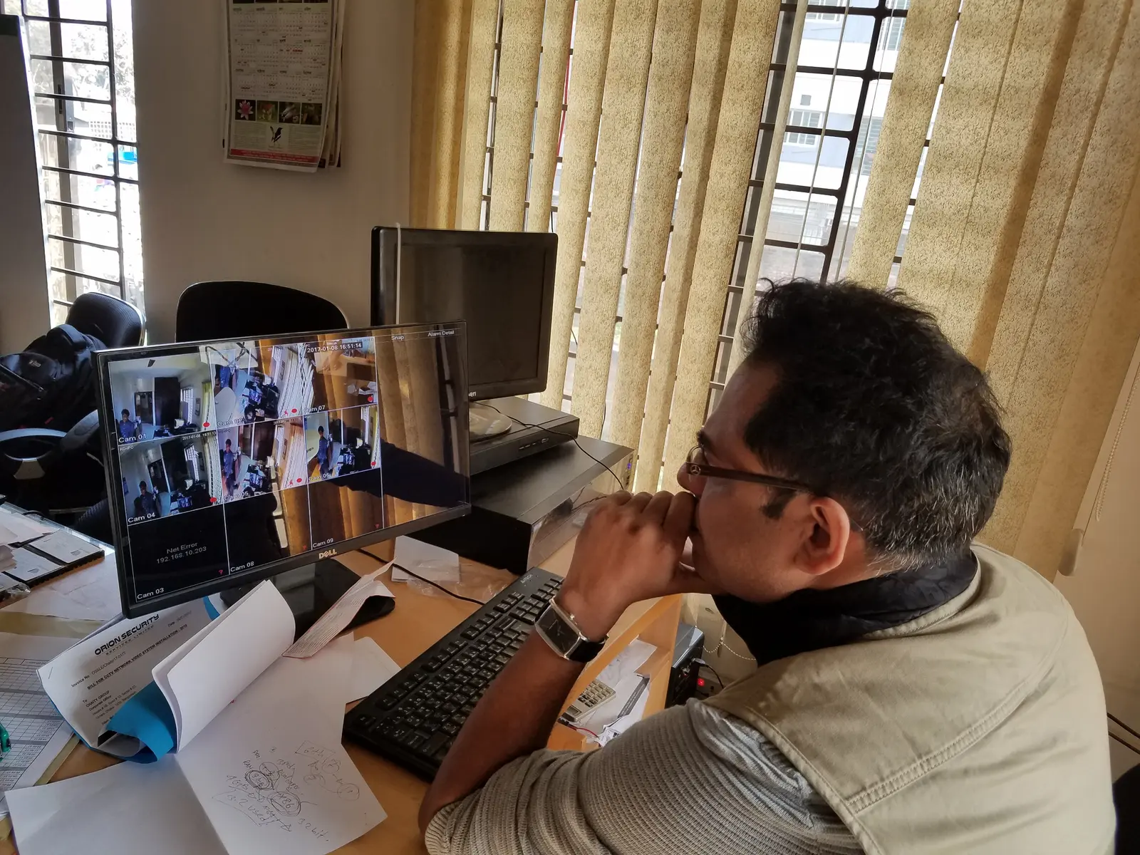 Md. Nurul Mannan Choudhury monitoring a multi-camera CCTV feed from the operations desk